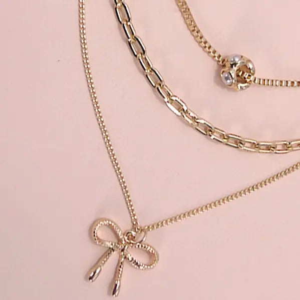 Mult Layer Pearl Bow Charm Necklace